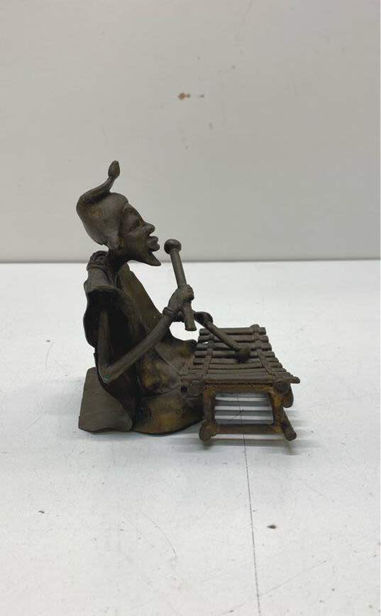 Hand Crafted Metal Figurine Seated Xylophone Player Sculpture image number 2
