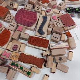 Bundle of Assorted Wooden Rubber Stamps & Craft Brads alternative image