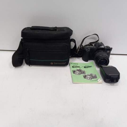 Canon EOS RebelX T3 SLR Film Camera With Strap Attached, In Samsonite Case With Speedlite 200 E Flash, and Camera Instructions image number 1