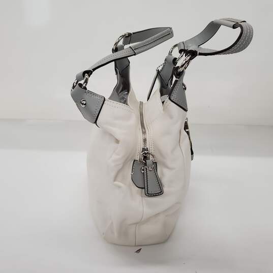 Moderate wear with some scuffs and scratches.  Coach Soho Lynn Soft White Leather Gray Trim Hobo Shoulder Bag image number 4