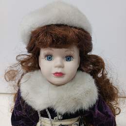 Vintage Porcelain Doll w/Clothing and Stand alternative image