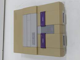 Vintage Super Nintendo Entertainment System with Two Controllers alternative image