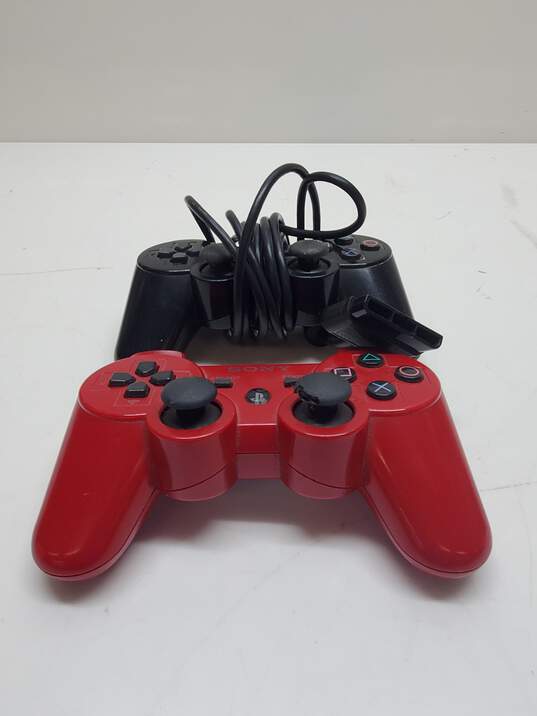 x2 Sony Playstation Controllers Wireless and Corded Black & Red image number 2
