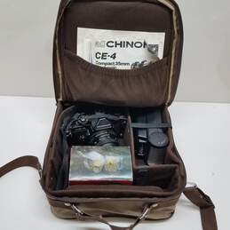 Chinon CE-4 compact 35mm SLR camera with accessories and case
