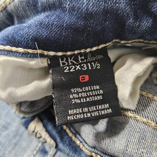 BKE Blue Denim Distressed Super Low Rise Skinny Jeans image number 3