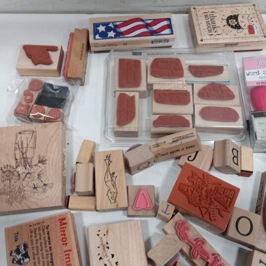 Bundle of Assorted Wooden Rubber Stamps & Craft Brads image number 3