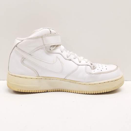 Nike Air Force 1 Mid Triple White Sneakers 315123-111 Size 9.5 image number 1