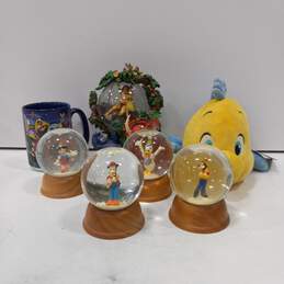 Bundle of 7 Disney Merchandize Items (4 First Edition Slow Globes, 1 Rare Musical Snow Globe, 1 Disneyland Mug, 1 Disney Store Stuffed Animal)