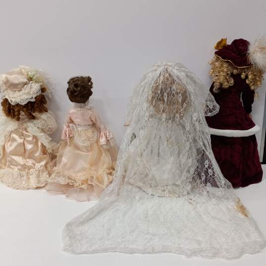 Bundle of 6 Assorted Porcelain Dolls w/Clothing image number 3