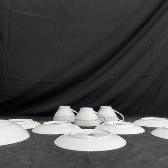 Bundle of Assorted White Noritake Saucer, Tea Cups & Plates w/ Floral Design image number 4