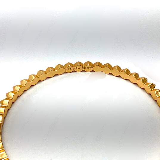 Designer Kendra Scott Gold-Tone Practical Spiked Design Bangle Bracelet image number 2