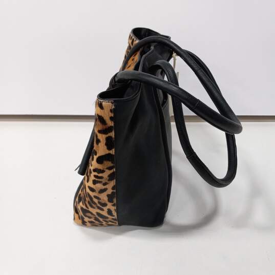 Lucky Brand Animal Print Front Leather Solid Black Back Shoulder Tote Bag NWT image number 3