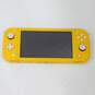 Yellow Nintendo Switch Lite W/ 2 Games Portal Knights Carnival Games image number 2