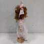 Dynasty Doll Collection Porcelain Doll With Strawberry Blonde Curly Hair And Brown Eyes In Pink Outfit image number 3