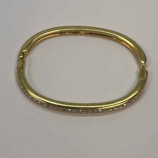 Designer Swarovski Gold-Tone White Rhinestone Hinged Bangle Bracelet image number 2