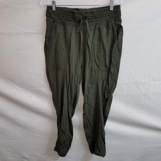 Buy the Lululemon olive green loose fit studio active pants