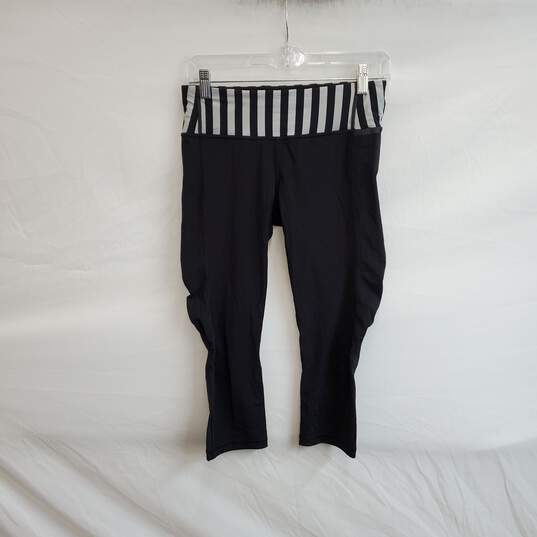 Buy the Lululemon Black & light gray Striped Capri Leggings WM Size 6
