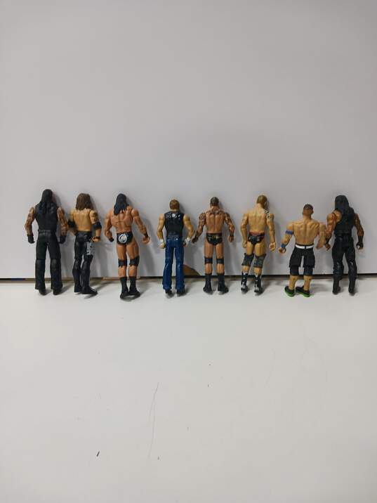 Lot of 8 Assorted WWE Wrestling Action Figures & Accessories image number 5