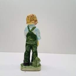 Porcelain Young Boy with Overalls and Hat Figurine alternative image