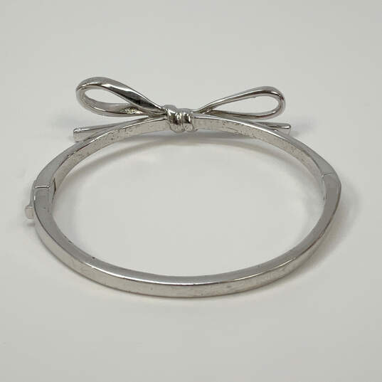 Designer Kate Spade Silver-Tone Bow Hinged Classic Bangle Bracelet image number 3