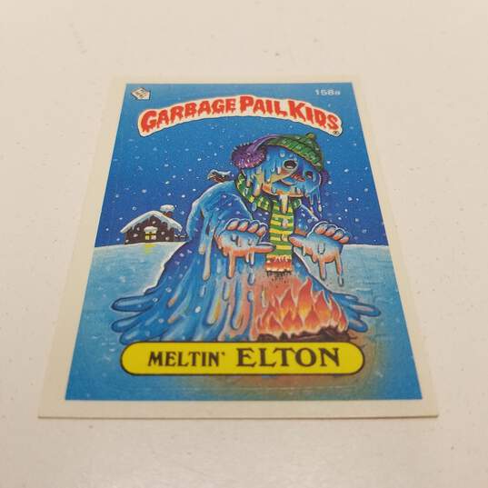 Vintage 1986 topps Garbage Pail Kids Meltin' Elton (158a) Trading Card Sticker image number 1