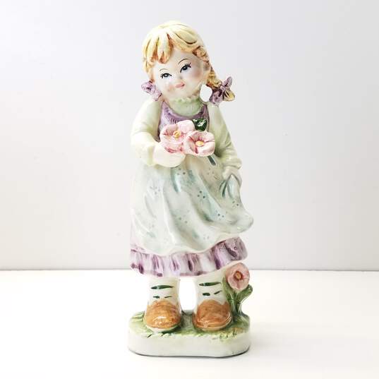 Porcelain Young Girl with Flowers Figurine image number 1