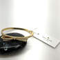 Designer Kate Spade Gold-Tone Love Notes Rhinestone Hinged Bangle Bracelet image number 1