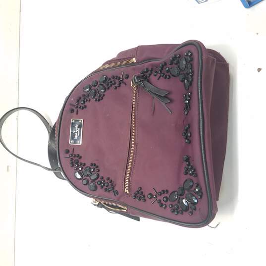 Buy the Kate Spade Dark Purple Small Backpack | GoodwillFinds