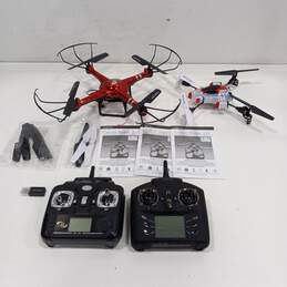 Pair of Quadcopter Drones with Remote Controls