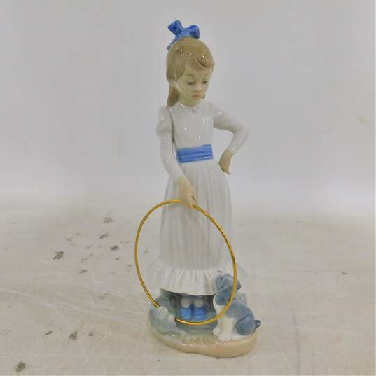 Nao by Lladro My Dog Does Tricks Girl with Hoop & Dog Figurine 0379 image number 1