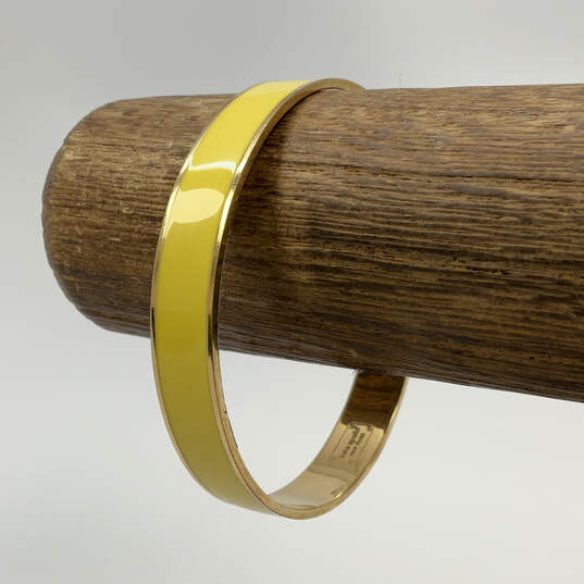 Designer Kate Spade Gold-Tone Yellow Round Bangle Bracelet With Dust Bag image number 1