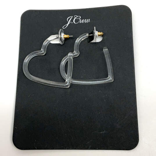 Designer J. Crew Silver-Tone Heart Shap Acetate Clear Hoop Earrings image number 1