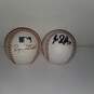 Pair of Signed Baseballs by Players #45 and 52 image number 1
