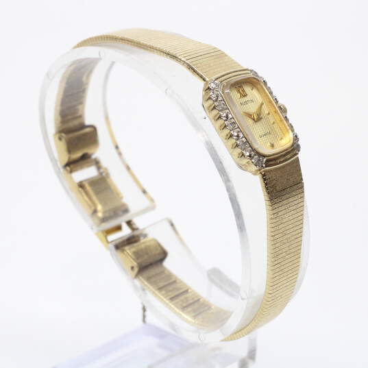 Buy the Austin Quartz Gold Tone Diamond Bezel Accent Watch | GoodwillFinds