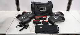 Title Boxing Bag w/2 Pairs of Boxing Gloves, 2 Pairs of Inner Gloves, Mesh Bags for the Inner Gloves, and 2 Straps