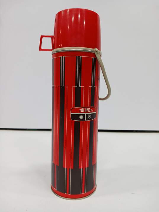 Vintage Thermos Red and Black Drink Container w/Cup Lid image number 1