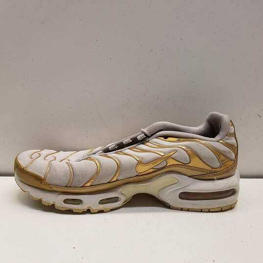 Nike Air Max Plus White Gold Women's Athletic Shoes Size 7.5 image number 2