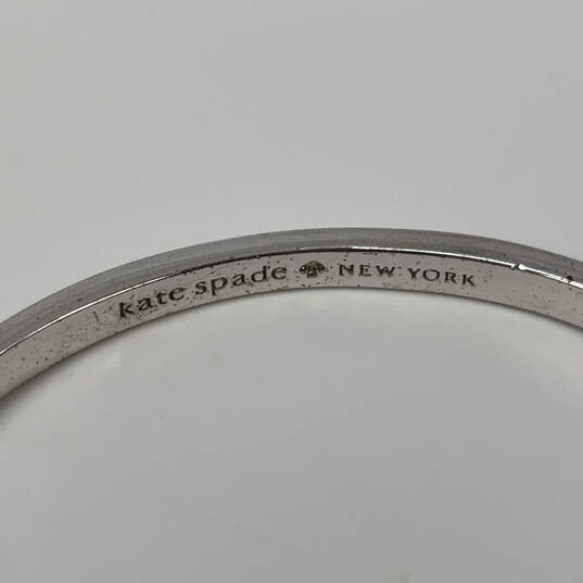 Designer Kate Spade Silver-Tone Bow Hinged Classic Bangle Bracelet image number 4