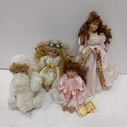 Four Assorted Porcelain Dolls