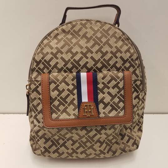 Buy the Tommy Hilfiger Signature Brown Faux Leather Mini Backpack