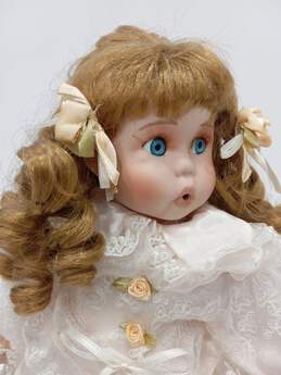 Vintage Porcelain Doll With Dog Nipping At Dress Skirt alternative image