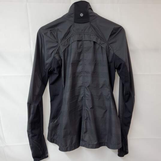 Lululemon Black High Neck Full Zip Up Jacket in size 6. - Depop