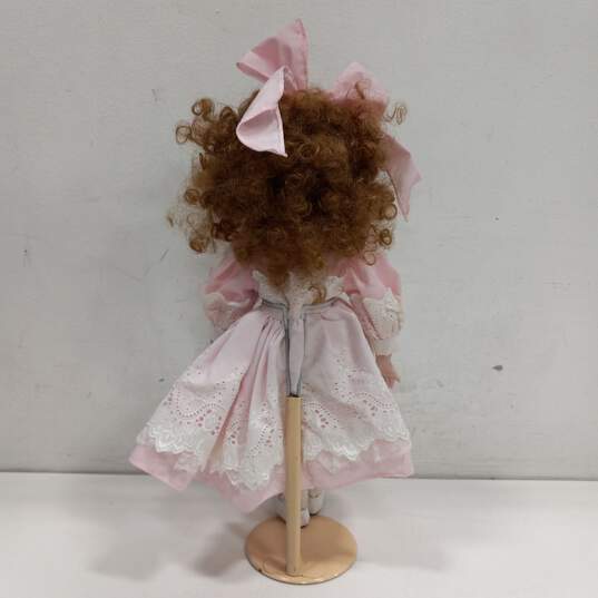 Dynasty Doll Collection Porcelain Doll With Strawberry Blonde Curly Hair And Brown Eyes In Pink Outfit image number 4