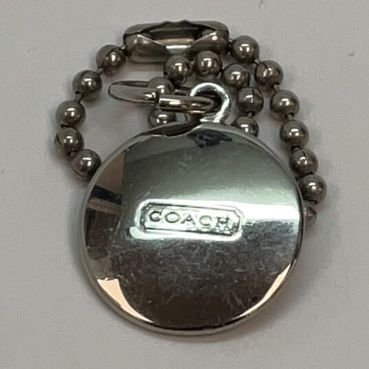 Designer Coach Silver-Tone Embossed Beaded Disc Round Shape Key Chain image number 2