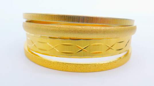 Vintage Monet Gold Tone Textured Stacking Bangle Bracelets 73.8g image number 1