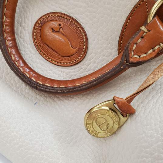 Buy the Vintage Dooney & Bourke All-Weather Leather Speedy Handbag Satchel  in Bone White/British Tan
