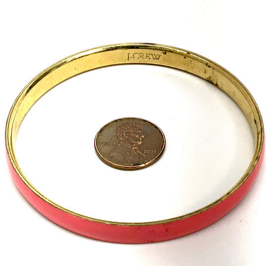 Designer J. Crew Gold-Tone Pink Enamel Round Shape Bangle Bracelet image number 2