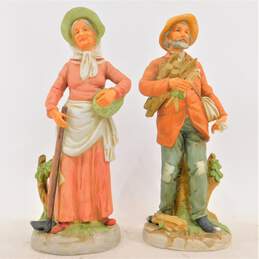 Vintage HomCo Farmer Couple Man w/ Sticks & Woman Gardener Porcelain Figurines