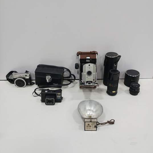 Lot of Vintage Cameras, Lenses, Flashes, And Cases image number 1