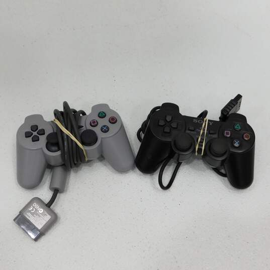 Sony PlayStation W/ 4 Games and 2 Controllers image number 13